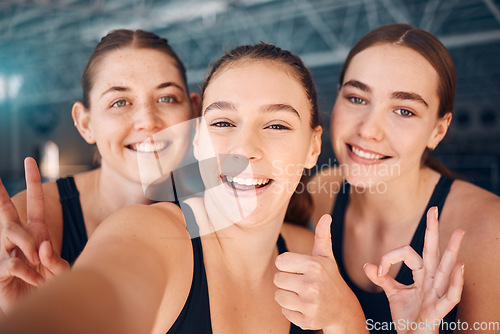 Image of Woman, friends and smile for selfie with thumbs up, OK and peace sign of swimming team at the gym. Happy women smiling showing hand gesture for photo, profile picture or memory together indoors