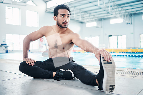 Image of Athlete, fitness and man stretching by a pool ready for training, practice or exercise for a competition. Body, sport and male swimmer preparing for workout as health, performance and wellness