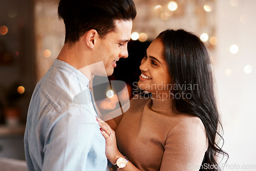 Image of Love, romance and happy couple hugging on a date for valentines day, romantic event or anniversary. Happiness, smile and interracial man and woman embracing after a dinner celebration together.