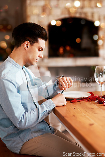 Image of Romance, waiting and man checking the time while sitting in the restaurant for a valentines day date. Fine dining, late and guy by the table for dinner reservation for anniversary or romantic event.