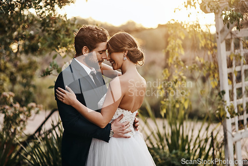 Image of Wedding, love and couple in garden for marriage, ceremony celebration and commitment. Save the date, trust and bride and groom hug, embrace and happy to celebrate romance, smile and loving in park