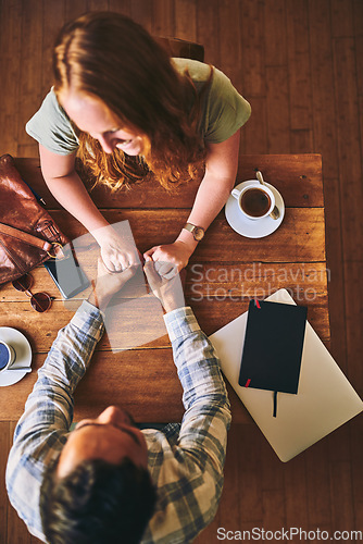 Image of Above, couple and coffee shop with holding hands, love and conversation for romance at table. Man, woman and valentines date in cafe for support, bonding and talking with happiness, care and trust