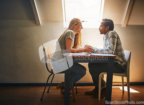 Image of Holding hands, love and couple on table at restaurant, laughing at funny joke and bonding. Valentines day, romance diversity and affection, passion or care of man and woman enjoying date time at cafe