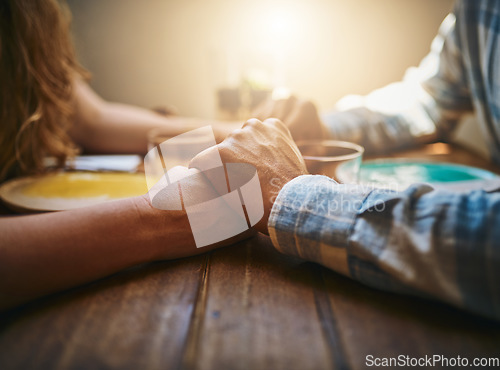 Image of Love, couple and holding hands at restaurant on table, for care and bonding together. Valentines day, romance and affection, passion of man and woman on romantic date enjoying quality time in cafe.