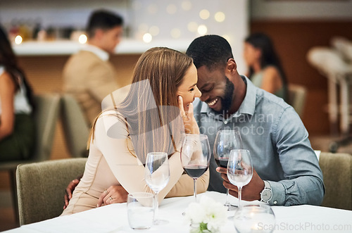 Image of Funny, date and interracial couple with red wine for fine dining, luxury restaurant or valentines celebration together. Black man, happy woman and alcohol glasses for romance, wealth or anniversary