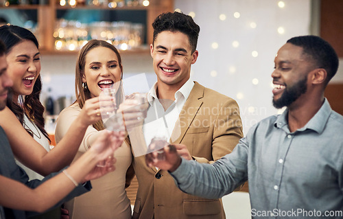 Image of Group of friends, cheers and shots in celebration at restaurant party and happiness together for valentines day. Love, friendship and toast, happy hour social event, people smile at pub drinks date.