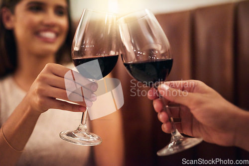 Image of Hand, wine glasses and couple in restaurant for achievement, celebration or romance on Valentines day. Romantic, man or happy woman with zoom, cheers or alcohol for date, affection or toast with love