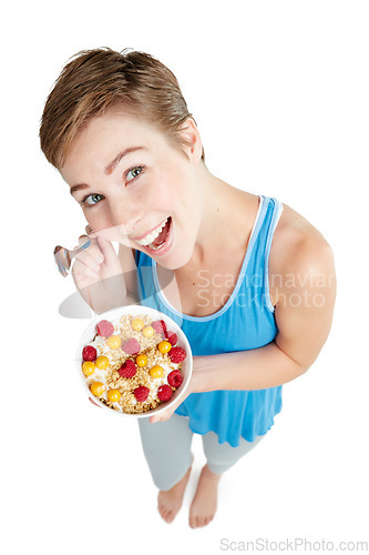 Image of Portrait, breakfast and food with a woman in studio isolated on a white background for health from above. Diet, muesli and overhead with an attractive young female eating healthy for nutrition