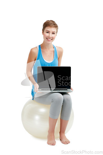 Image of Laptop mockup, fitness and woman isolated on a white background sitting on balance ball and pc screen. Happy model or person with computer mock up space for advertising or product placement in studio