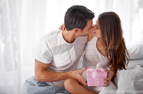 Image of Man giving woman present, love and happiness with partnership, relationship and celebration on Valentines day date. Couple smile with gift box, luxury and commitment, gratitude and celebrate holiday