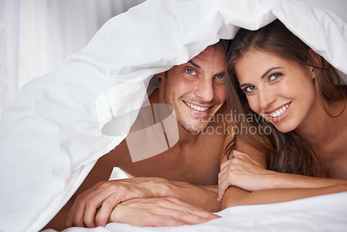 Image of Love, portrait and couple in bed, waking up and bonding in a bedroom together, flirting and romantic. Face, man and woman relax, intimate and resting at hotel for valentines day, anniversary or bond