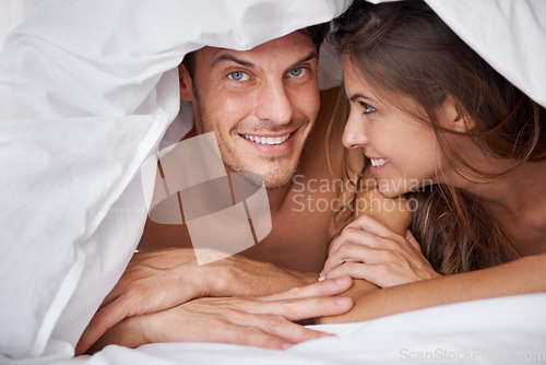 Image of Love, portrait and couple relax in bed, waking up and bonding in a bedroom together, happy and romantic. Face, man and woman, intimate and resting at hotel for valentines day, anniversary or bond