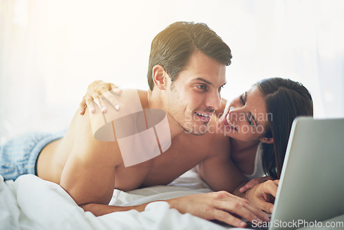 Image of Couple with laptop, streaming and relax in home with technology, wifi and happy to chill together. Love, commitment and relationship with man and woman in bedroom with film website subscription