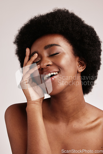 Image of Beauty, black woman and skincare of a young person face with hands happy about facial. Wellness, cosmetics and model in a isolated studio with a smile doing dermatology, detox and spa self care