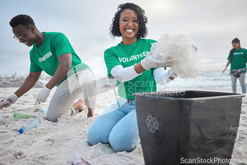 Image of Teamwork, cleaning and volunteer with people on beach for sustainability, environment and eco friendly. Climate change, earth day and nature with friends and plastic for help, energy and pollution