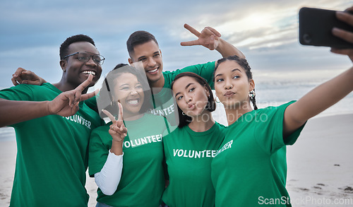 Image of Peace sign, selfie and volunteer with people on beach for sustainability, environment or climate change. Diversity, earth day and social media with friends and phone for technology, energy or charity