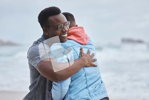 Image of Friendship, love and men hugging on the beach for a reunion while on a summer vacation or holiday. Happy, smile and loving gay couple embracing by the ocean while on a seaside weekend trip in Hawaii.