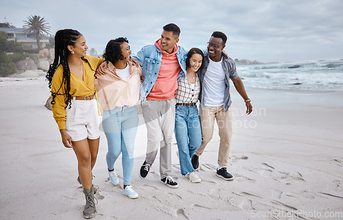 Image of Diversity, happy and friends walking at the beach for holiday, vacation and bonding on nature background. Men, smile and women group relax at the sea, laugh and cheerful on an ocean trip in Miami