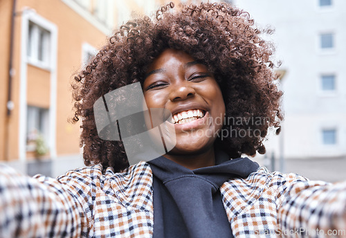 Image of Black woman, portrait and selfie in city, urban town or fun in Kenya. Happy young african female smile in video call, photograph or face of happiness, curly afro hair and freedom on social media blog