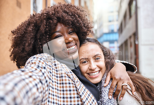 Image of Friendship, happy and portrait of women on a holiday together walking in the city street in Italy. Happiness, smile and interracial female gay couple hugging in the road in town while on a vacation.