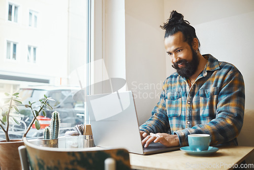 Image of Coffee shop, laptop and man planning a project for a creative freelance job with a cappucino. Technology, computer and male freelancer doing research for a creativity report with a latte in a cafe.