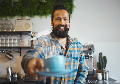 Image of Cafe, portrait and man barista with a coffee for a customer in his small business restaurant. Happy, smile and male waiter or server giving a cup of cappucino, latte or espresso in his cafeteria shop