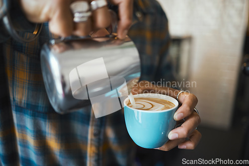 Image of Latte art, coffee and barista hands with process, workflow and production with drink and working in cafe. Creative, man drawing with milk foam and hospitality with service and beverage closeup