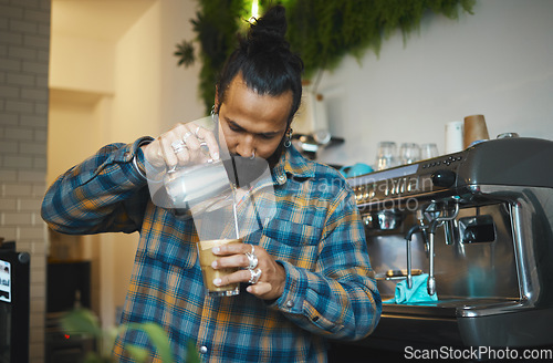 Image of Barista in coffee shop, latte art and process with man, working and design with milk foam and espresso. Small business, production and workflow, service and creative with focus and artistic in cafe