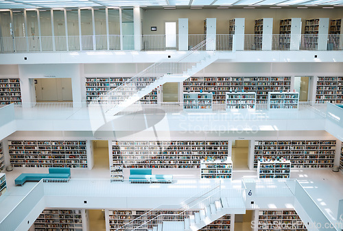 Image of Library, interior design and university for education, learning and knowledge building background. Campus, bookshelf, architecture and empty room or stairs space for learning, scholarship or research