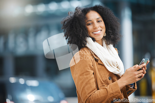 Image of Phone, happy and portrait of a black woman in the city networking on social media, mobile app or internet. Happiness, smile and African female typing a text message on a cellphone in town with 5g.