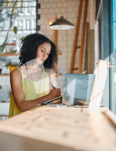 Image of Business owner, black woman and writing for planning, remote work from home or focus on new project. African American female, employee or entrepreneur with laptop, making notes or thinking for growth