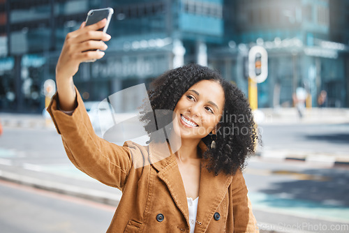 Image of Travel, selfie and black woman in a city, happy and smile on vacation against urban background. Blog, social media and girl influencer live streaming trip in New York for online, followers or network
