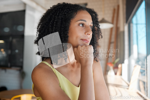 Image of Face, thinking and a black woman waiting in a coffee shop for her order or date while feeling bored. Idea, alone or window and an attractive young female sitting in a cafe with her hand on her chin