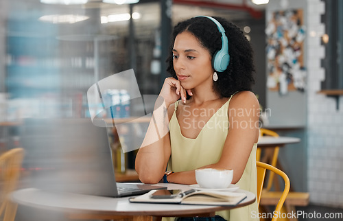 Image of Video call, laptop and black woman in coffee shop for meeting, virtual conference and networking. Communication, cafe and girl with headphones on computer for webinar, freelance and remote work