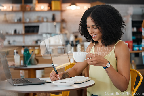 Image of Coffee shop, laptop and woman writing notes for a freelance project while drinking a espresso. Technology, notebook and female freelancer from Mexico planning business report with a cappucino in cafe