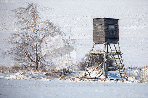 Image of Winter hunting tower covered with snow