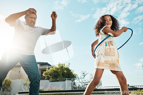 Image of Games, outdoor and grandfather with child for body wellness, health and dancing with hoop in summer. Happy family, senior person and Mexico girl kid playing together with energy in backyard blue sky