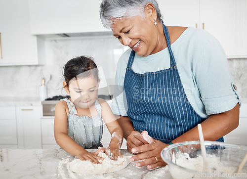 Image of Love, grandmother and girl baking, learning and happiness on weekend, break and teaching skills. Female kid, old woman or granny with granddaughter in kitchen, dough or bonding with child development