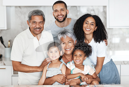 Image of Big family, smile and portrait in home kitchen, bonding and having fun together. Love, support and happy father, mother and grandparents with girls, kids or children, smiling or enjoying quality time