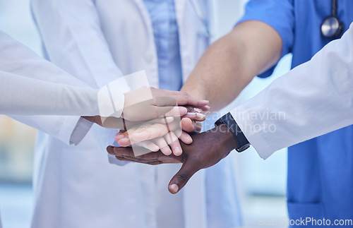 Image of Healthcare, teamwork and hands together in huddle for team building, collaboration and motivation at hospital. Doctors, diversity and medical employees in solidarity for help and support in medicine.