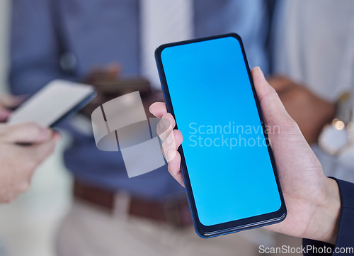 Image of Green screen, phone and hands of business people for mobile app, design mockup and product placement. Smartphone, technology and blue background for communication, networking chat or social media ux