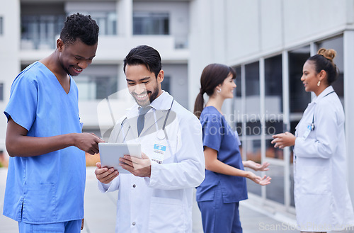 Image of Doctors, research or team building on tablet outdoor for collaboration, networking or medicine search. Happy, medical or group of nurse smile on tech for strategy, communication or test data review