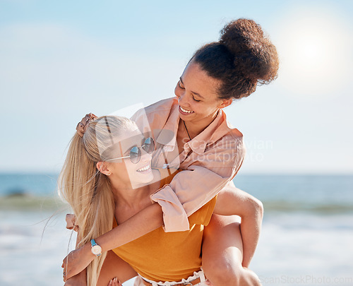 Image of Piggyback, beach and happy couple of friends with lgbtq, lesbian or love freedom on summer vacation. Blue sky, ocean and diversity women on date, fun support and valentines holiday with hug by sea