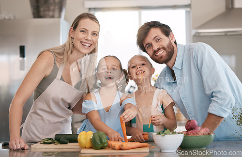 Image of Portrait of mom, dad and children cooking in kitchen with vegetables for lunch, food or meal prep together. Family, smile and parents with girls learning, teaching and helping for child development