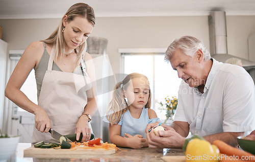 Image of Family home, cooking a vegetables with a child helping mother and grandfather in the kitchen. Woman, man and girl kid learning to make lunch or dinner with love, care and bonding over food together