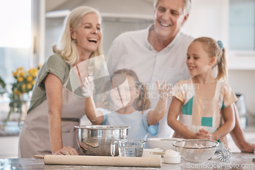 Image of Love, grandparents and girls baking, quality time and bonding on weekend, break and happiness. Child development, granny and granddad with female grandchildren, fun and loving together and cooking