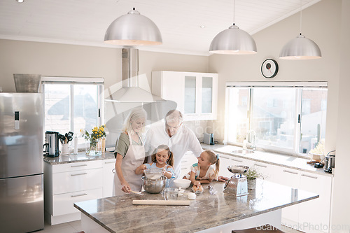 Image of Baking, senior family and children in kitchen bonding, love and learning in morning with breakfast help. Real people or grandparents and girl kids teaching, cooking and food with home development