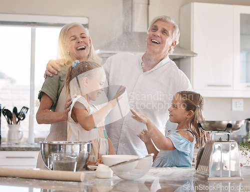 Image of Funny family, baking and children helping grandparents in home kitchen with food. Woman, man and girl kids learning to make cookies, pancakes or cake for breakfast with love, care and fun teamwork