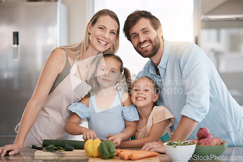 Image of Kitchen, cooking and portrait of parents and children with vegetables for healthy diet, food or meal prep together. Family, smile and mom, dad and girls learning, teaching and helping cut ingredients