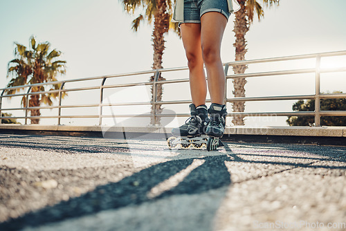 Image of Hobby, ground and legs of a woman on rollerskates for the weekend, fun activity and summer in Miami. Learning, urban and feet of a girl rollerskating on the floor in the urban city for a cool sports